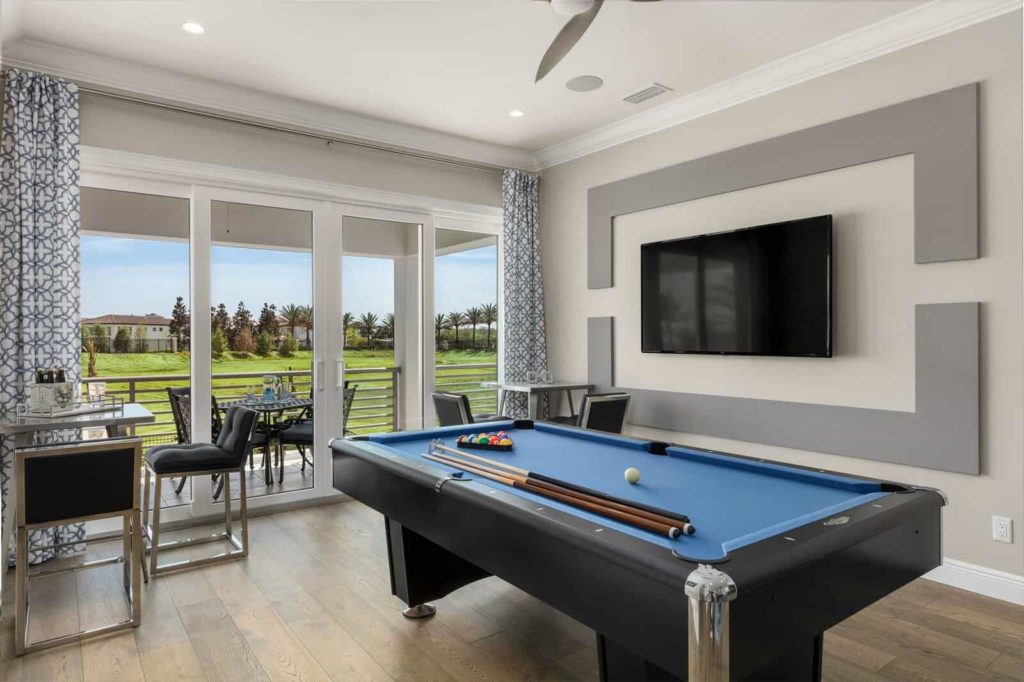 Furnished game room with pool table inside a Bear’s Den Resort vacation home.