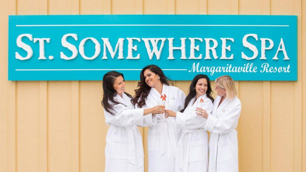 Group of women in spa robes outside Margaritaville Resort Orlando’s St. Somewhere Spa