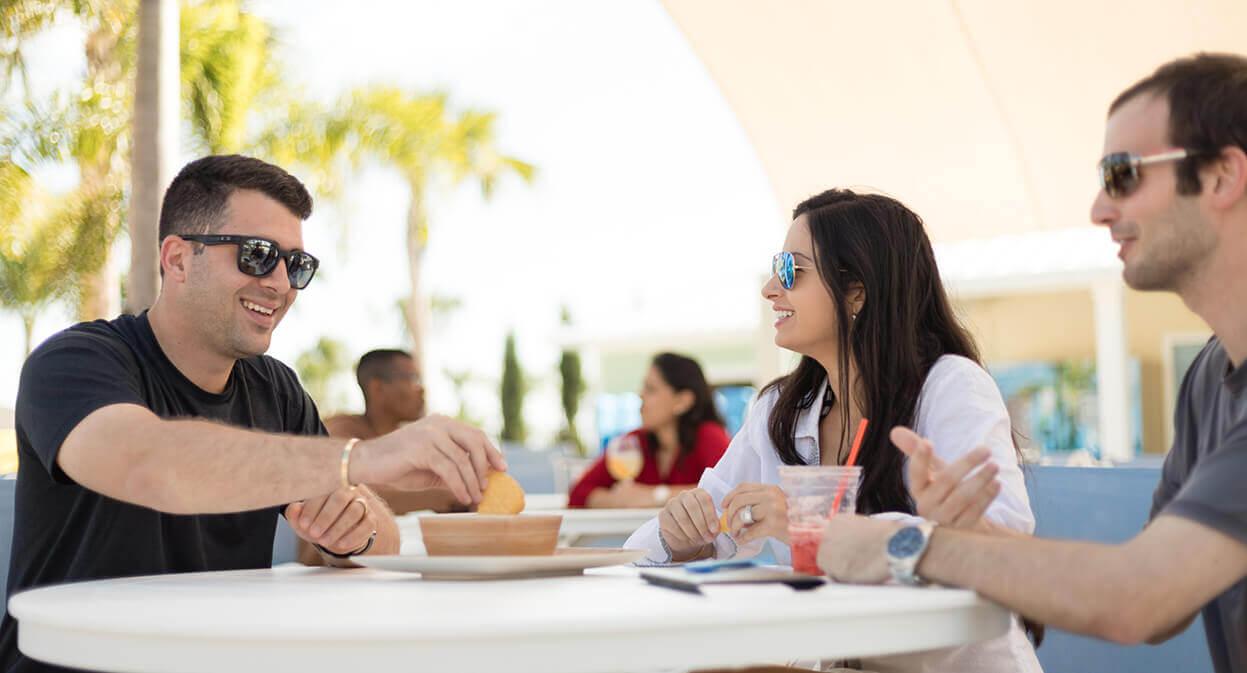 Group dining outside Bis Grill at Encore Resort at Reunion.