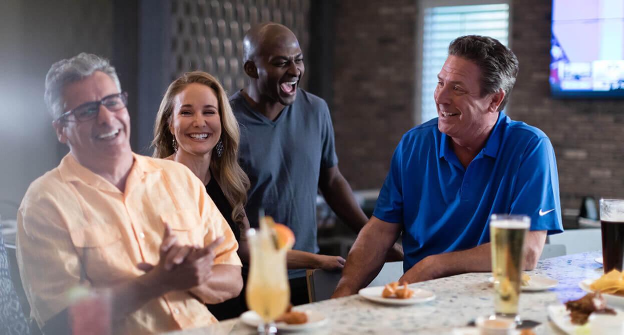 Dan Marino chats with a group at Shark Lounge at Encore Resort at Reunion.