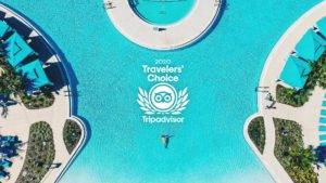 Tripadvisor 2020 Travelers’ Choice Award logo over an aerial view of the Margaritaville Resort Orlando pool.