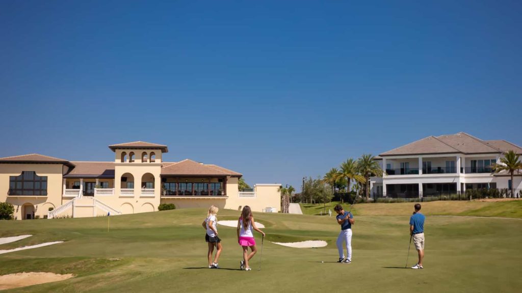 Two couples playing golf at The Bear’s Den Resort Orlando.