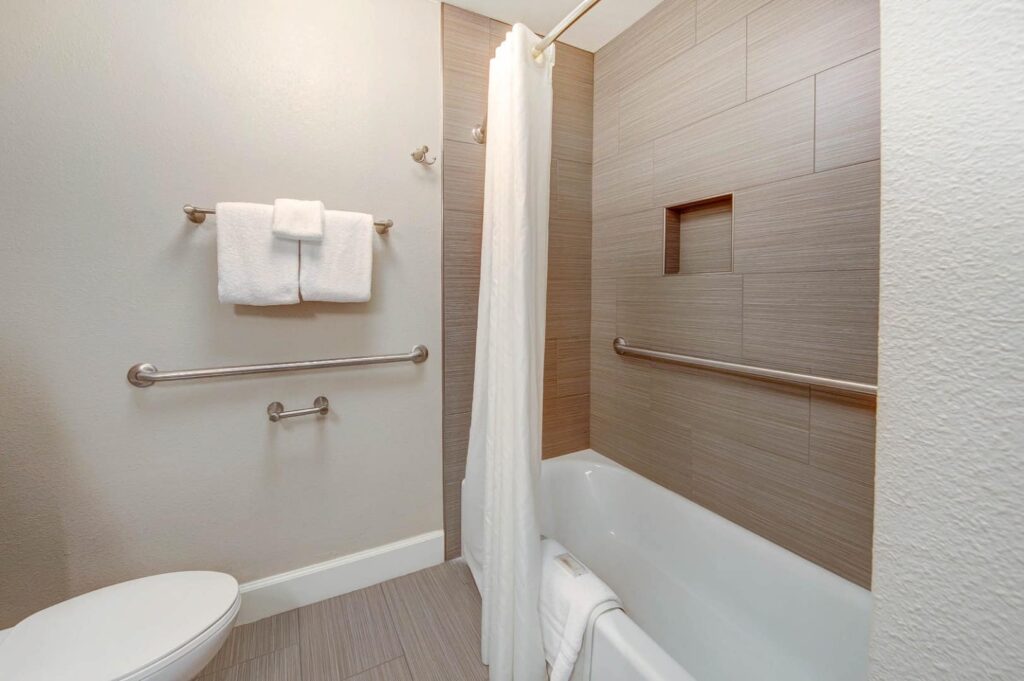 Bathroom with tub/shower combo at Pono Kai Resort
