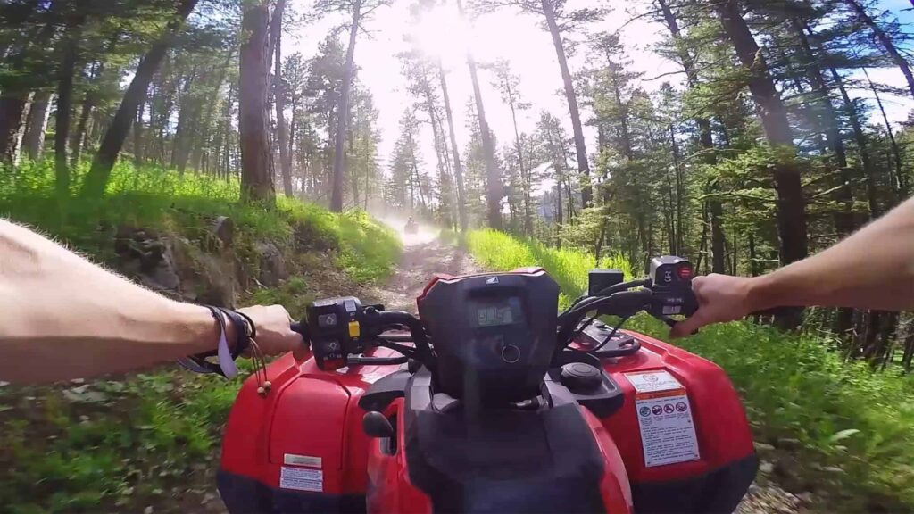 First-person view of an ATV ride through the woods at The Ranches at Belt Creek.