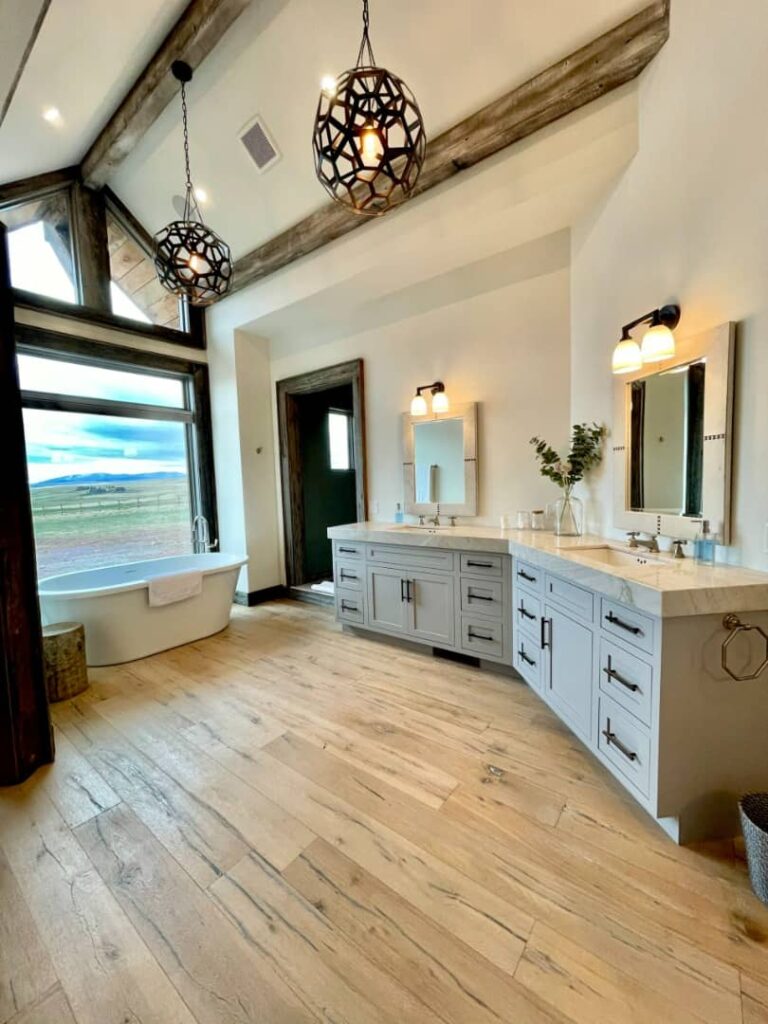 Lucky Man Ranch spacious bathroom with freestanding tub and mountain view.