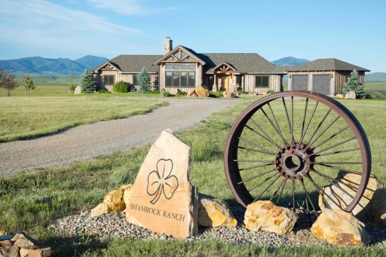 Shamrock ranch entrance with decorative wagon wheel