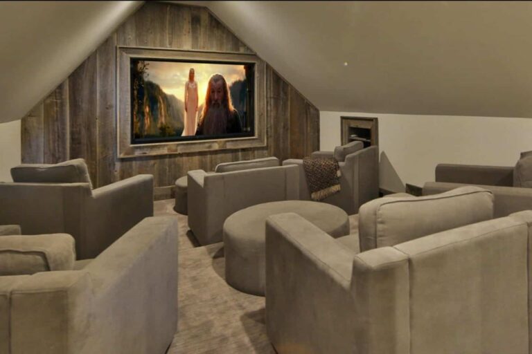 Shamrock ranch theater room with plush armchairs
