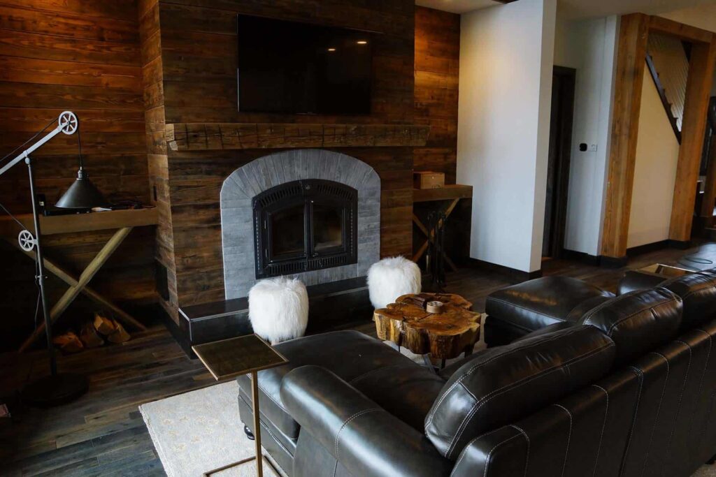 Sky Walker Ranch living room with large sofa and fireplace.