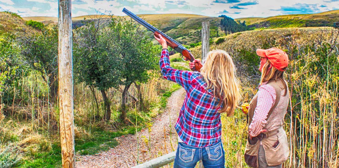 Women shooting sporting clays at The Ranches at Belt Creek.