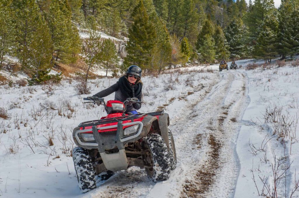 ATV rider in the snow at The Ranches at Belt Creek.