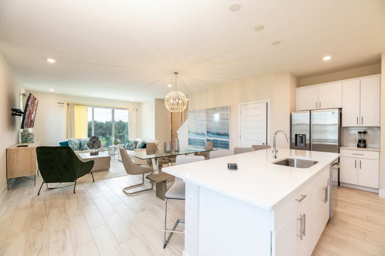 Spacious, modern kitchen, dining, and living room at Eagle Trace Resort Orlando.