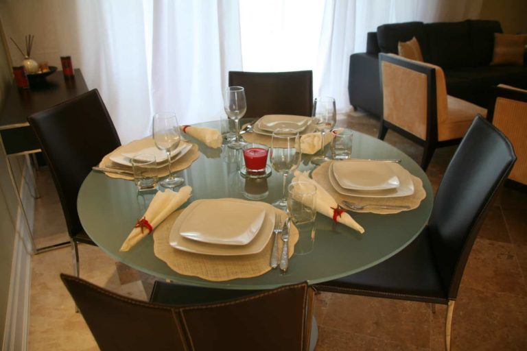 Dining room table with settings: 1 Bedroom Suite at The Atrium Resort