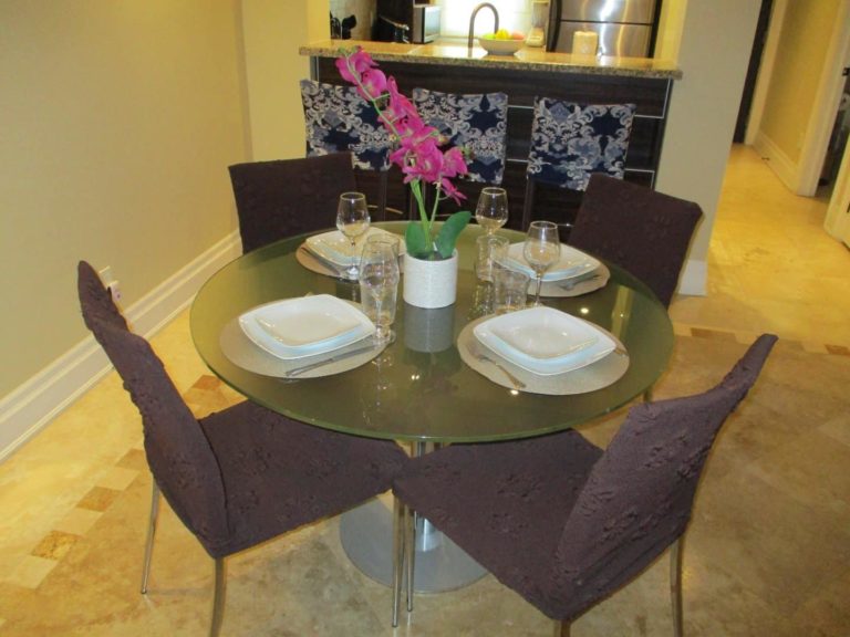 Dining room with table settings: Premium 1 Bedroom Suite at The Atrium Resort
