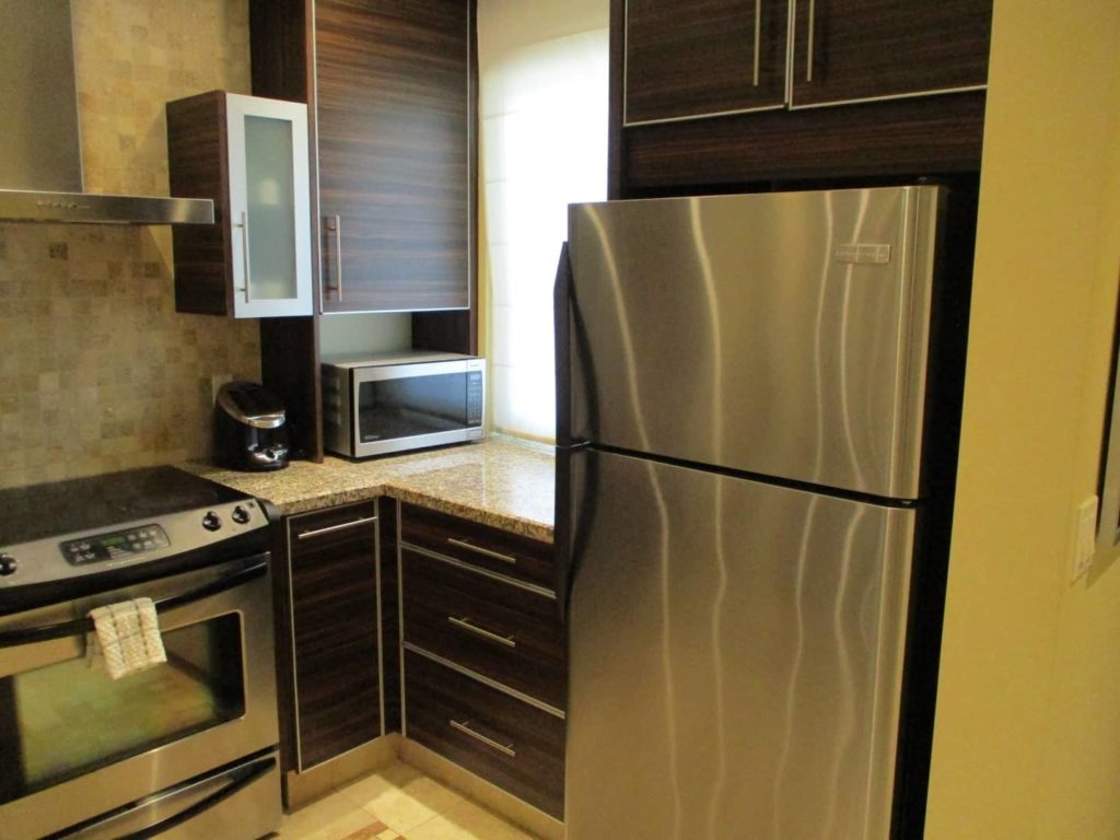Full kitchen with refrigerator: Premium 1 Bedroom Suite at The Atrium Resort