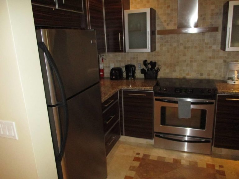 Full kitchen with oven range and refrigerator: 2 Bedroom Suite at The Atrium Resort