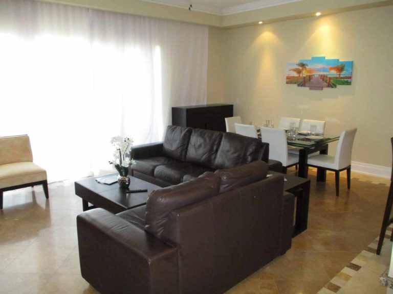 Living room with large, sectional sofa: 4 Bedroom Penthouse at The Atrium Resort