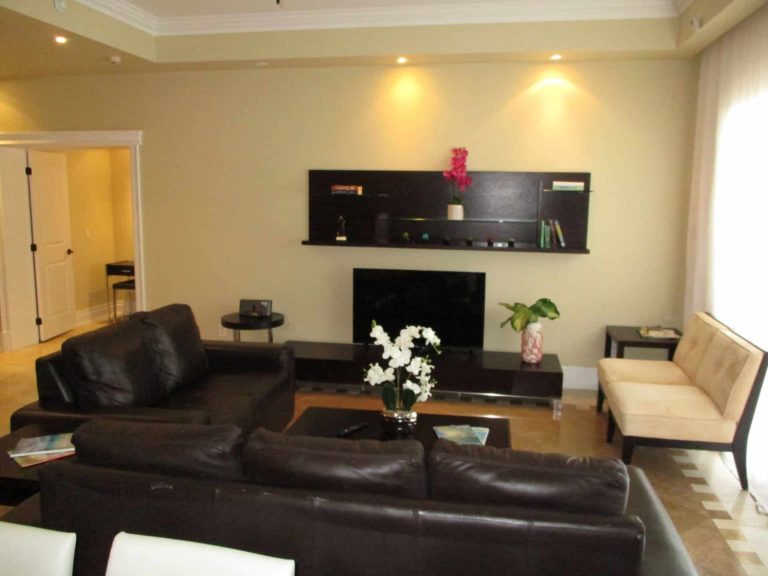 Spacious living room with large sofa and TV: 4 Bedroom Penthouse at The Atrium Resort