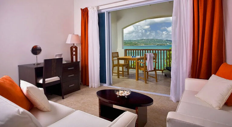 Sunset Ocean View Junior Suite sitting area and balcony.
