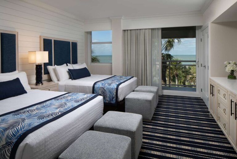 Double queen bedroom with beach view