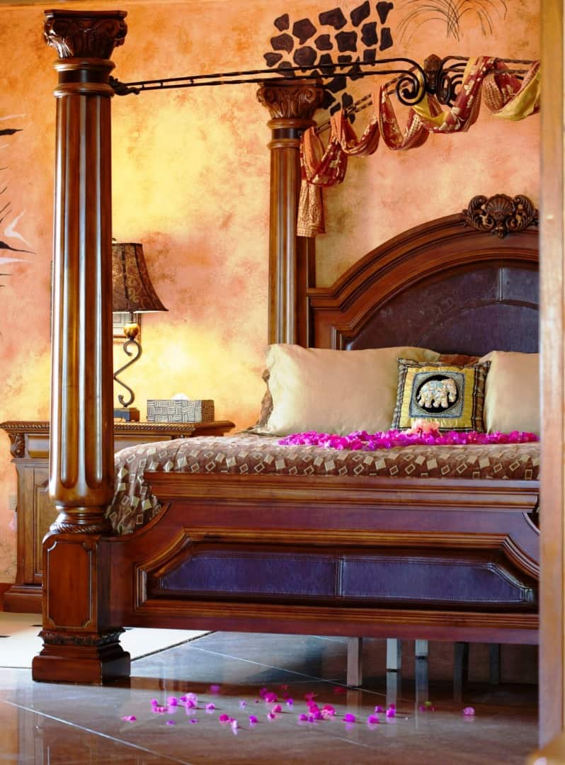 Honeymoon Suite deluxe king bed with rose petals