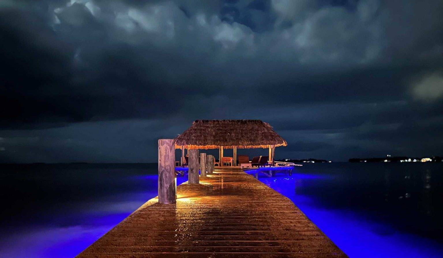 Chabil Mar Villas dock bar lit up at night