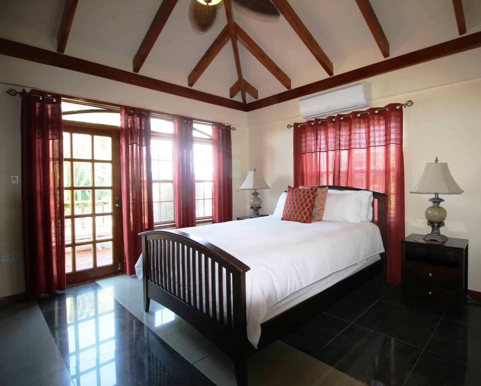 Larger Seafront Villa queen bedroom suite with beach view
