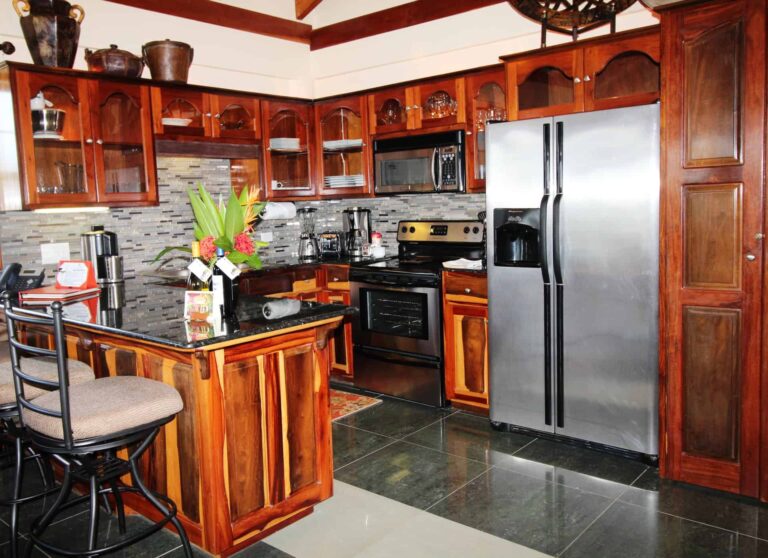 Larger Seafront Villa full kitchen with barstool seats