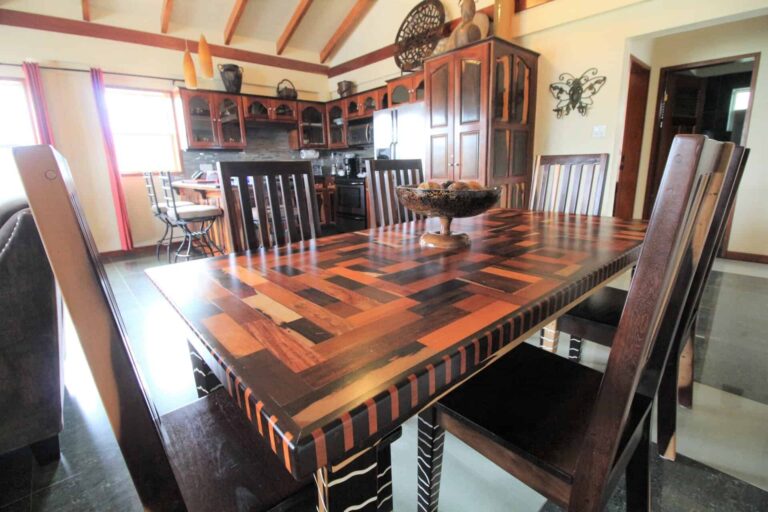 Larger Seafront Villa dining room table and kitchen