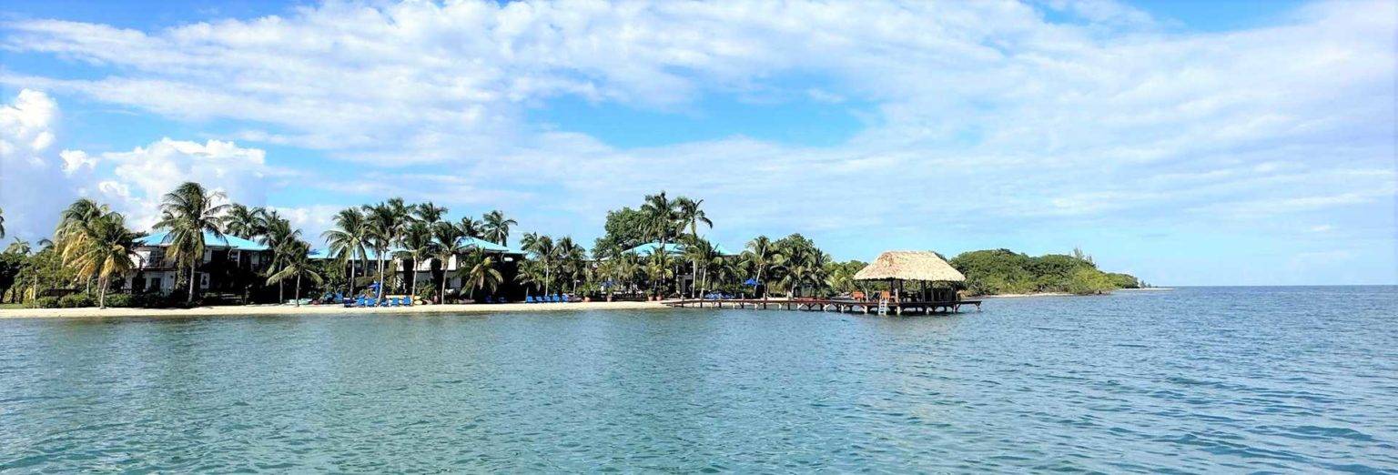 View of the Chabil Mar Villas dock and beach from the waters off the coast of Belize