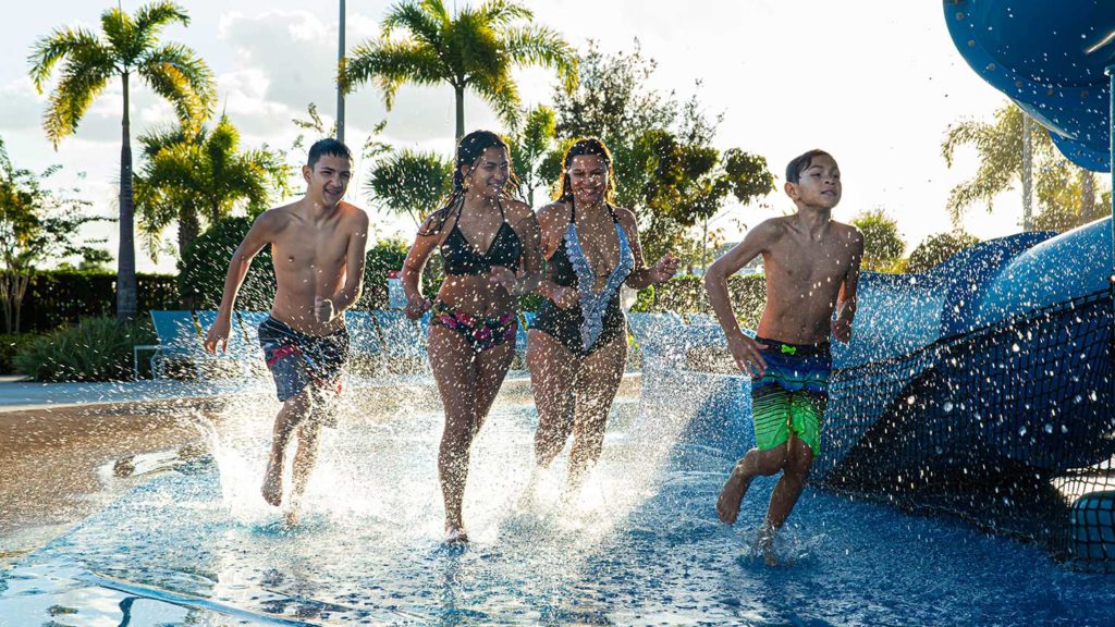Kids and teens splashing at a water park
