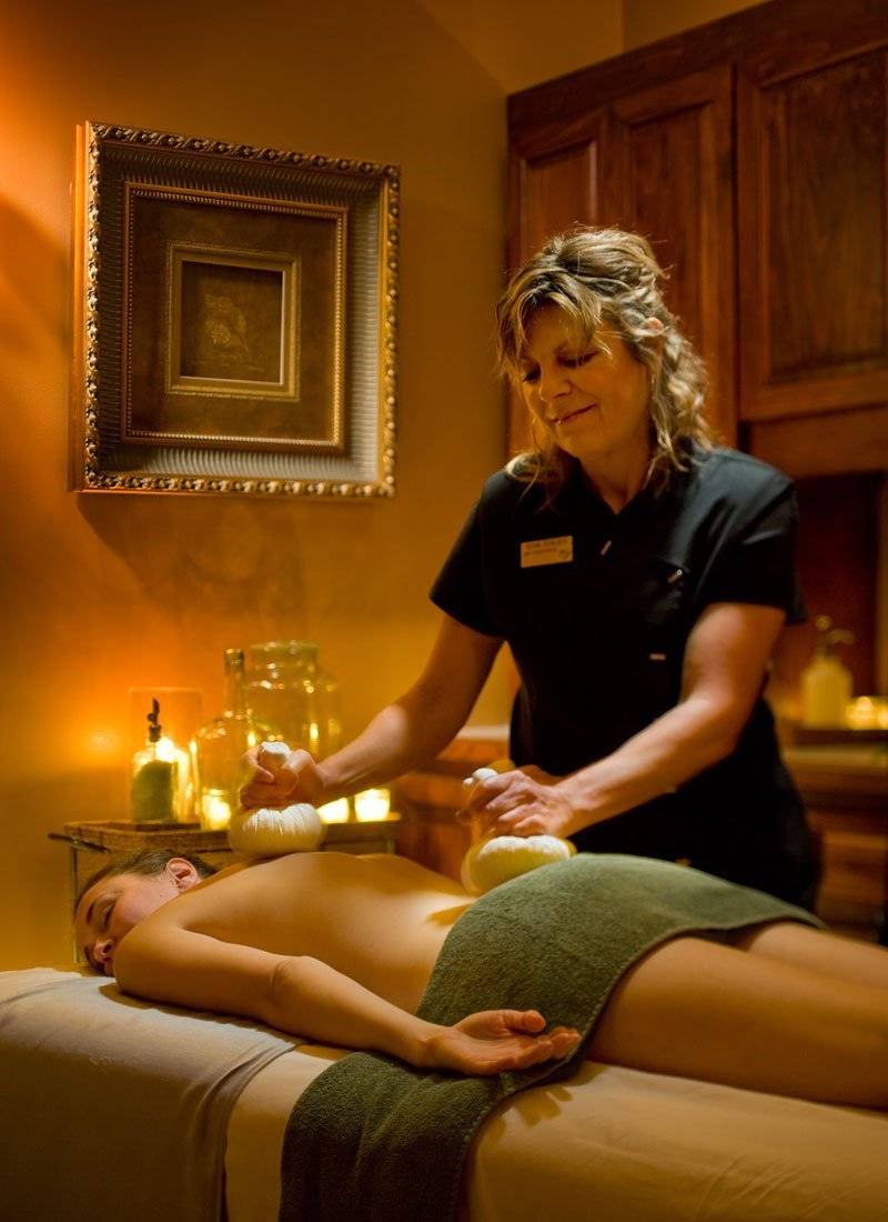 Woman receiving a massage during a spa treatment.