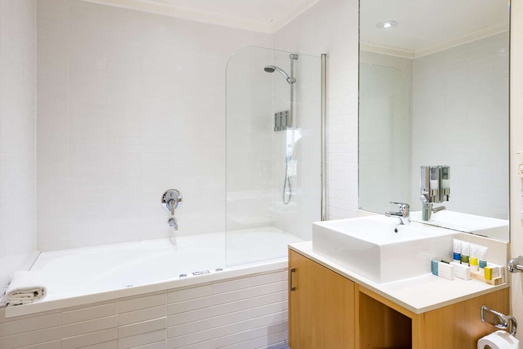 Two Bedroom Executive Apartment master bathroom with spa bath