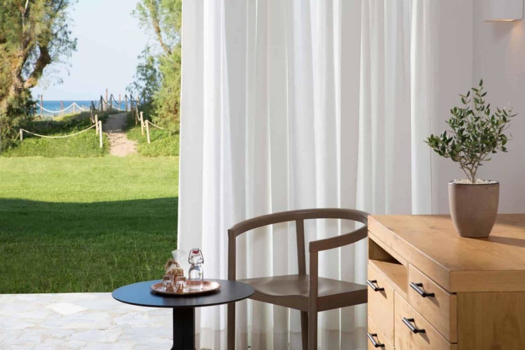 Family Bungalow corner siting area with coffee table and beach view