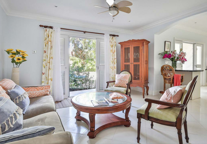 Furnished living room with access to outdoor private pool: Cap Cove 3 Bedroom Townhouse
