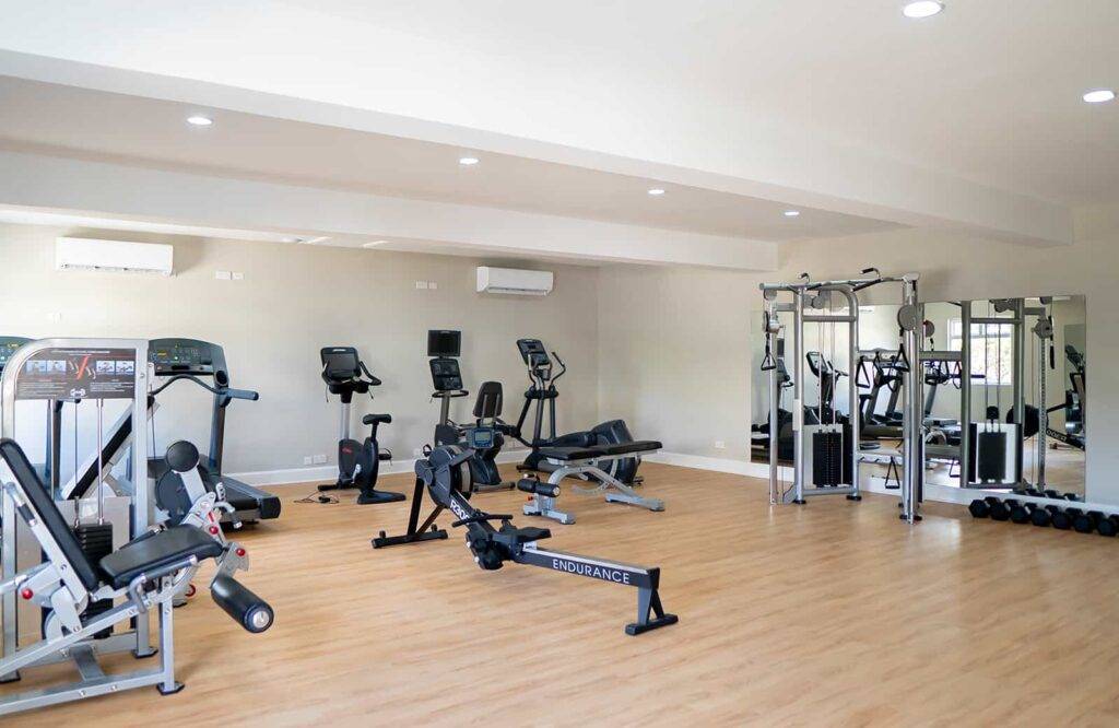 Fitness Center at Cap Cove with workout equipment and weights