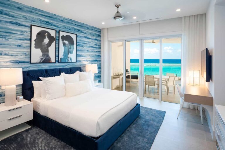 Bedroom with oceanfront balcony access: Rum Point Club 2 Bedroom Residence
