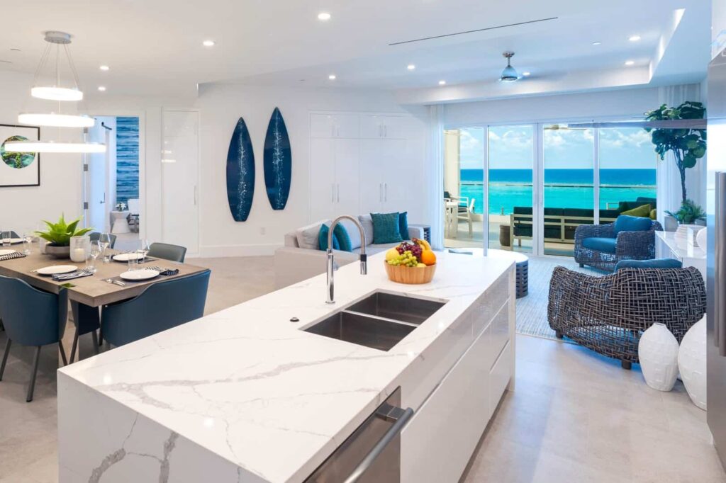 Living and dining room with ocean view: Rum Point Club 2 Bedroom Residence