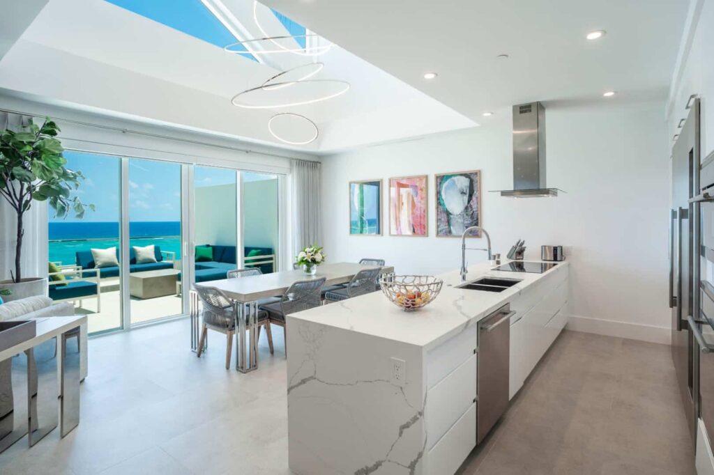 Kitchen and dining room with ocean view: 3 Bedroom Penthouse at Rum Point Club