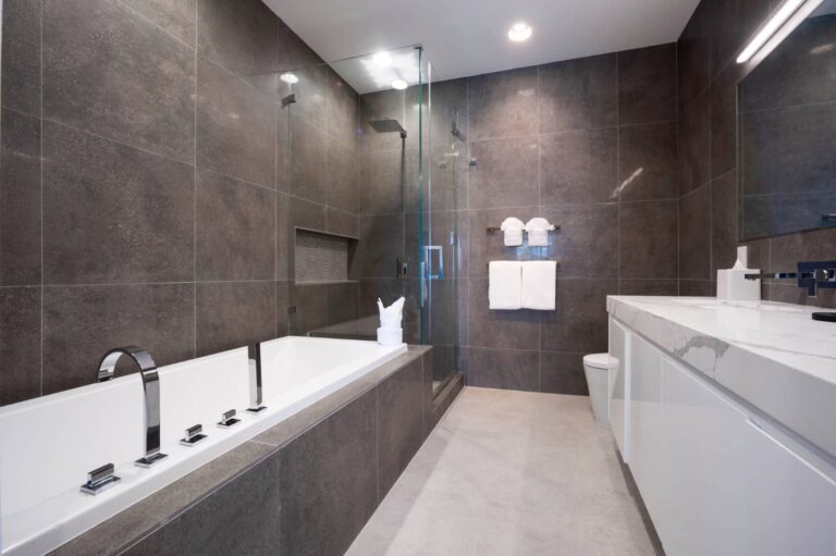 Spacious bathroom with standing shower and separate tub: 3 Bedroom Residence at Rum Point Club