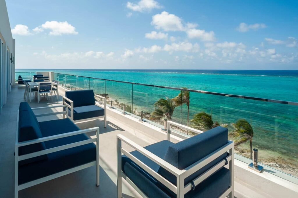 Expansive outdoor balcony overlooking the ocean: 4 Bedroom Residence at Rum Point Club