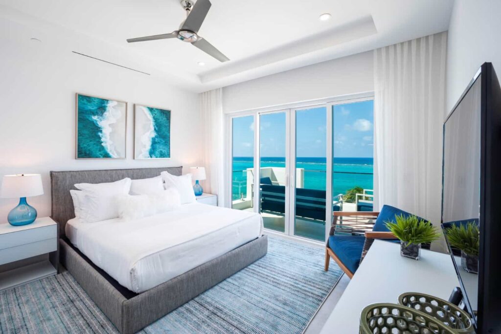 Master bedroom with ocean view: 4 Bedroom Residence at Rum Point Club