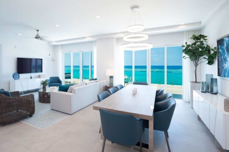 Living and dining room with ocean view: 4 Bedroom Residence at Rum Point Club