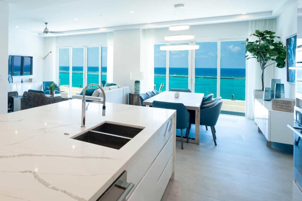 Kitchen and dining room with ocean view: 4 Bedroom Residence at Rum Point Club