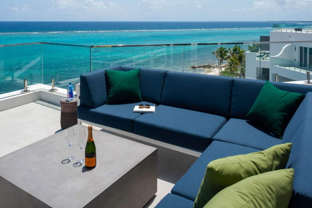 Outdoor balcony seating: 4 Bedroom Penthouse at Rum Point Club