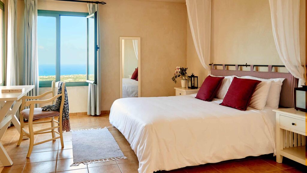 Village Heights Resort bedroom suite with ocean view