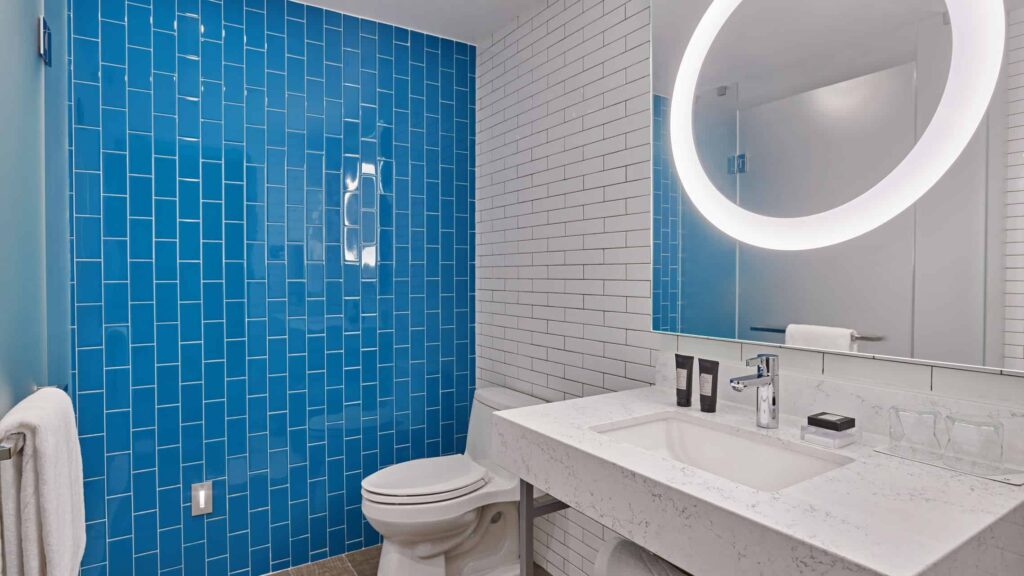 Modern bathroom with in-mirror light ring.