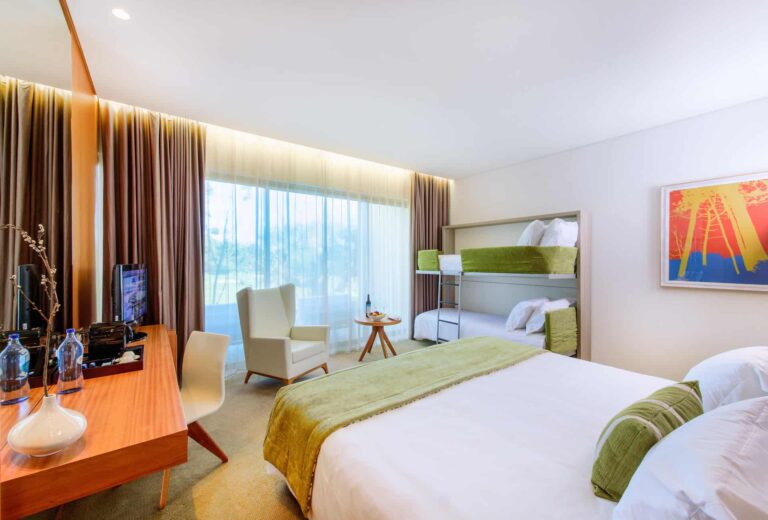 Deluxe Superior Room with king bed and designer bunkbeds for two children.