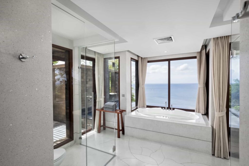 Ocean Pool Suite bathroom with large bathtub and ocean view