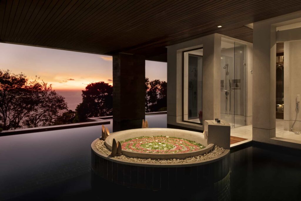 Spa Pool Suite marble sunken bathtub overlooking the ocean at sunset