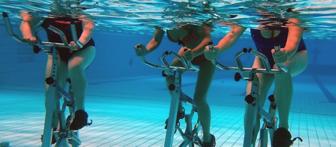 Underwater view of aquabikes in a pool